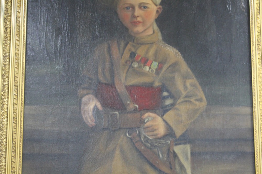 English School 1899, oil on canvas, Portrait of a boy wearing a turban and army uniform, indistinctly initialled and dated 1899, 98 x 6